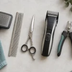 Illustration of dog grooming brushes, a comb, clippers and nail clippers